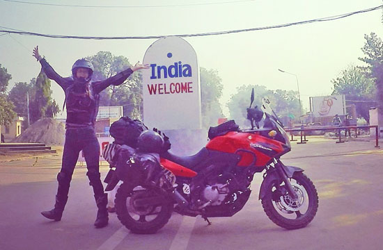 Noortje beside India sign