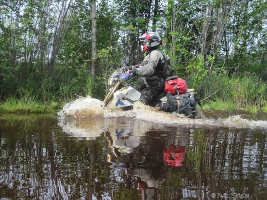 Chris Bright crossing river in Siberia.