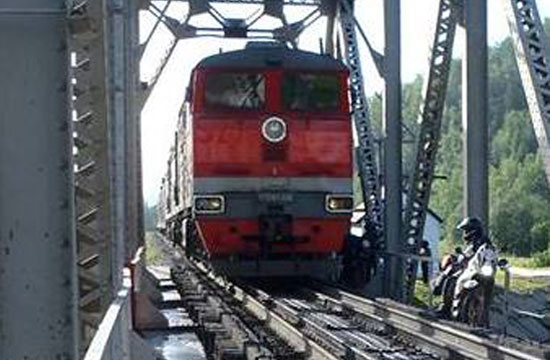 Jim and Gary dwarfed by a train.