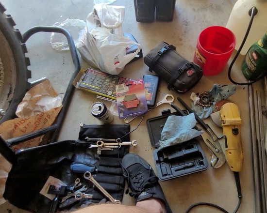 Irish George, moto tools on garage floor.