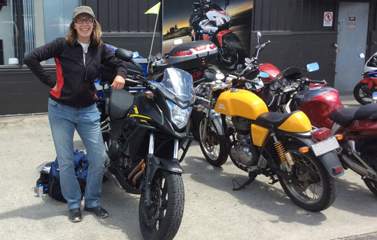 Jillian standing next to her bike.