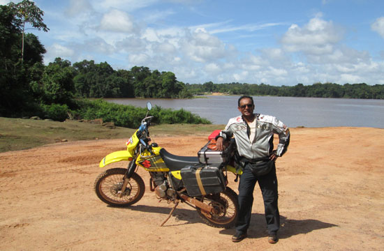 Moe and bike beside Amazon River
