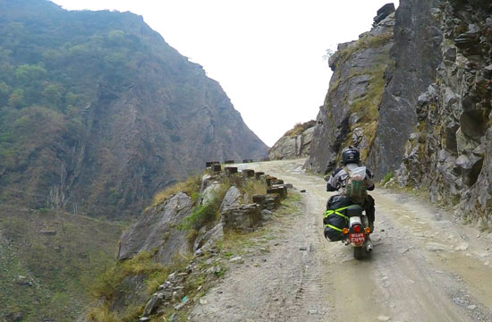 Michelle Solaro on a cliff-side dirt road.