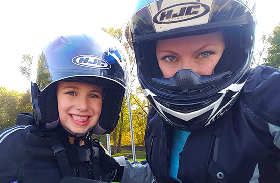 Brigitte and child in motorcycle helmets