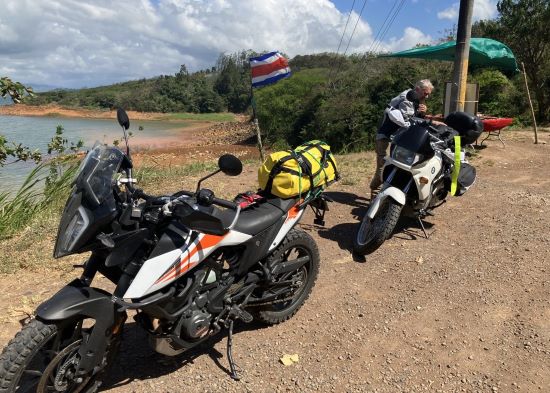 Jillian Henderson and Walter Romanowski, motorcycles at Lake Arenal.