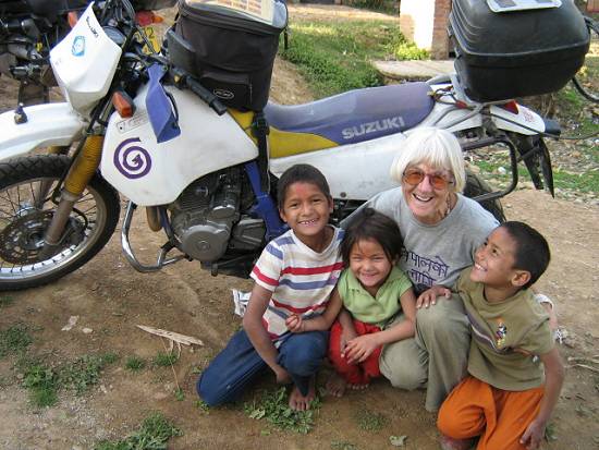 Linda Bick with kids at orphanage in Nepal.