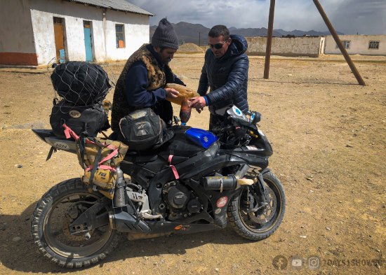 Ashim Ranadive refueling his GSXR600 sport bike.
