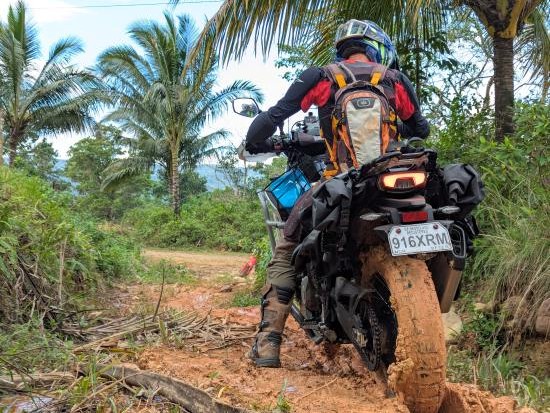 Marian Vulpe riding a muddy track.