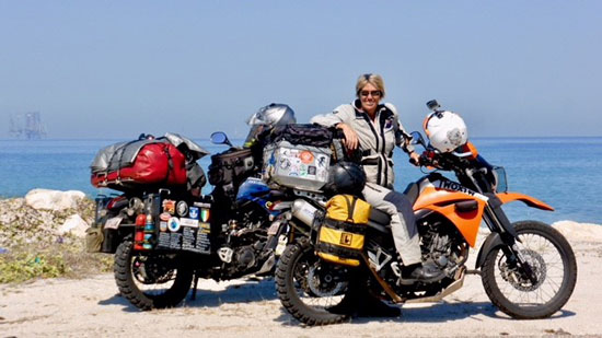 Lyn and the bikes with sunny ocean view.