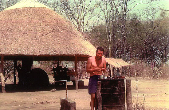 David Woodburn, Thatched hut in background