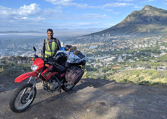 Rakesh Sridhar beside his motorcycle