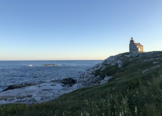 Lynn Howard, Small stone church on seaside bluff.