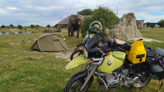 Melanie and Greg Turp, Elephant while motorcycle campling