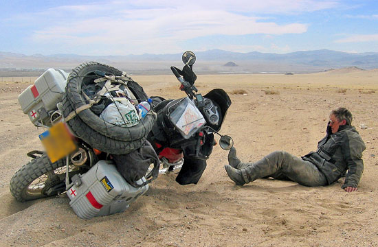 Loaded bike on its side in the desert