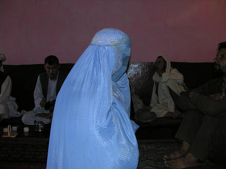 An anonymous burka begging in the restaurant