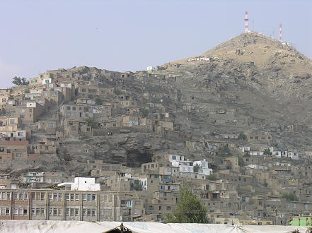 The treeless, mono coloured, mud brick housed hills of Kabul