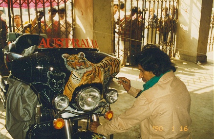 Local artist painting the tiger and cubs