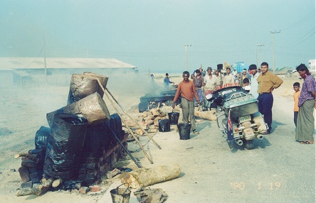 Boiling asphalt to cover the road