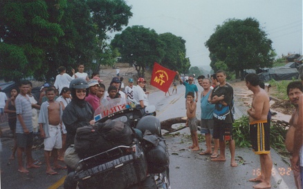 Locals protest, blocking the road, in rain, eventually we were allowed to pass