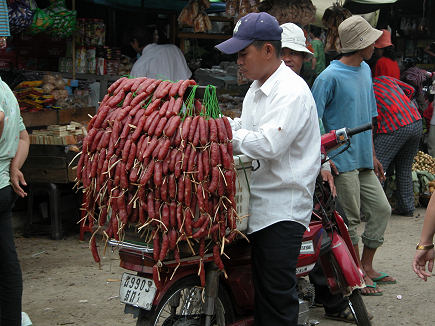 Selling sausages off the back of a motorcycle