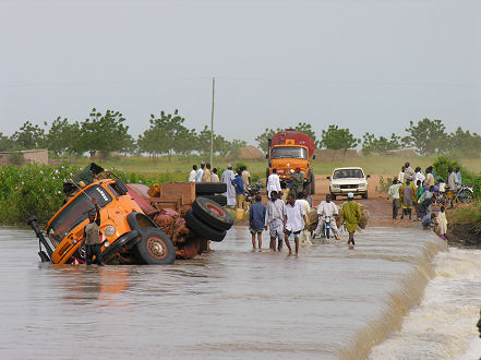 One of three trucks blocking causeways near the border after the rains