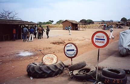 Roadside stop, collecting bribes or produce from passers by