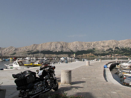 Glary limestone hills a backdrop to Baska