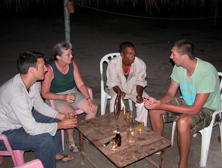 Trying the local palm wine with friends