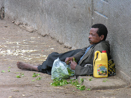 Man using Khat (qat) in a Harar street