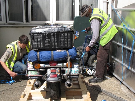 Packing the motorcycle at James Cargo's warehouse in the UK