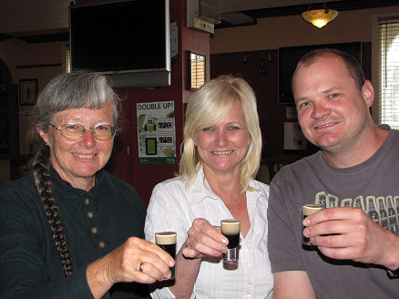Kay, Liz and Michael about to drink slippery nipples at Liz's pub
