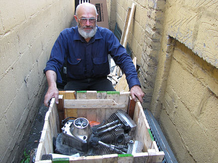 Crated old engine ready for repair or shipping to Australia