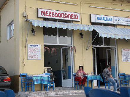 Octopus hang drying outside a restaurant