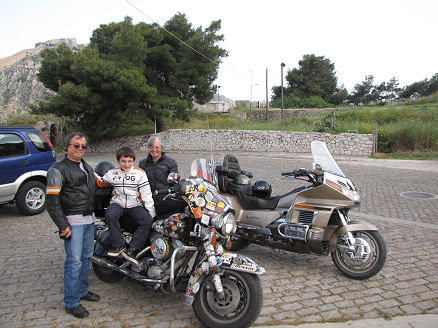 Haris, his nephew, Kay and our motorcycles in Nafplio