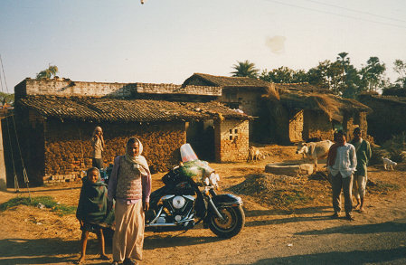 Drying cow manure on the house wall for cooking fuel