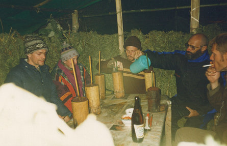 Enjoying millet beer with the locals and tourists