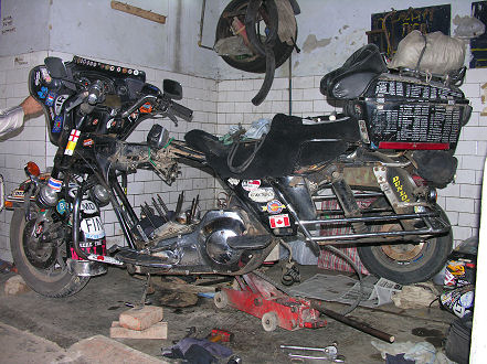 The motorcycle stripped for repairs and storage