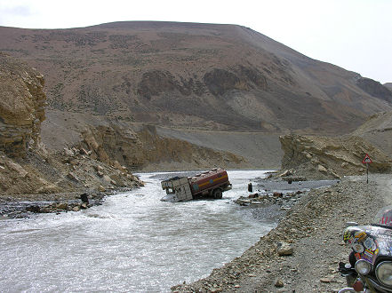 Truck didn't realise crossing was washed away and bridge just opened