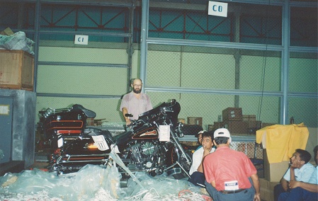 Unwrapping the bubble wrapped bike at Bali Airport