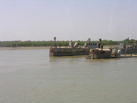 A couple of the many wrecked boats and marshland on the Iraq side of the river.