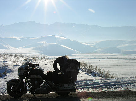 Glistening, frost covered snow, alongside the road all day