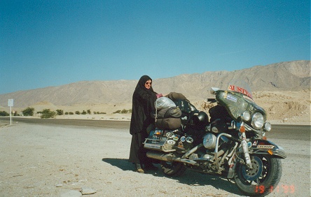 Kay getting used to riding in the chador, gathering up all the flowing material