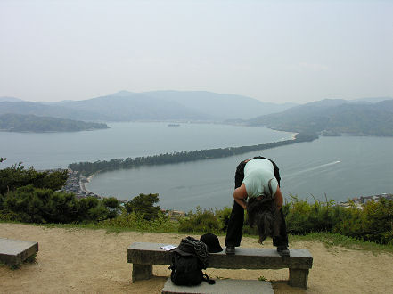 Kay getting the correct view, upside down, of the sand spit at Amanohashidate
