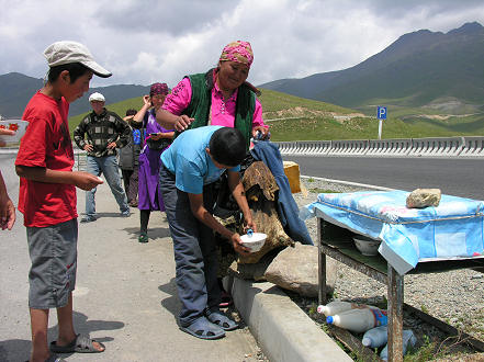 Drinking sour mares milk fermented in a sheep skin