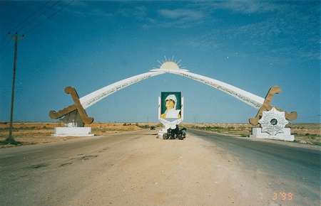 Colonel Gadaffi, and us under the crossed swords