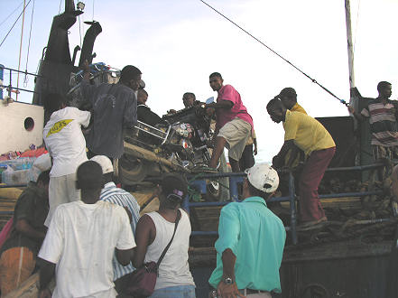 Dragging the motorcycle over the guard rails in loading