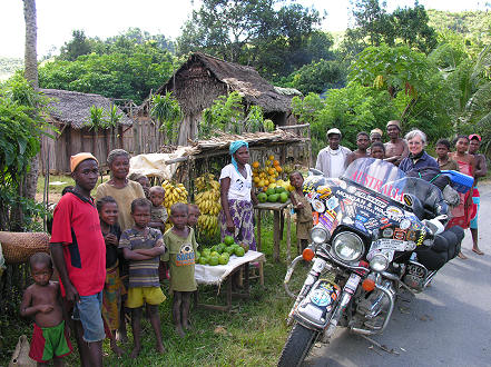 Buying local fruits from a roadside family