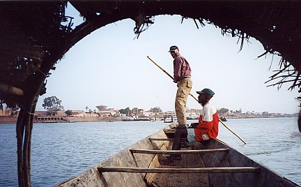 Having a go at poleing a boat on the river