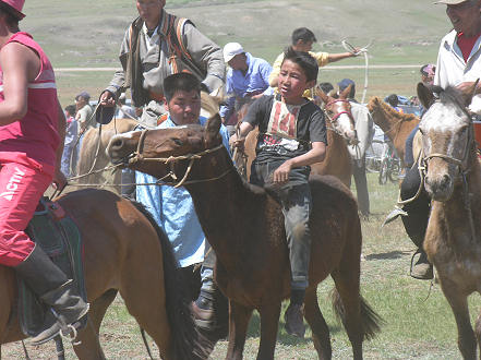 After the race, tired participant being helped off his horse