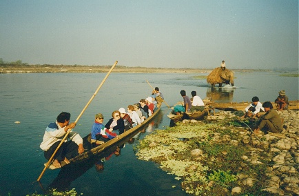 Older foreign tourists canoeing in Chitwan Park